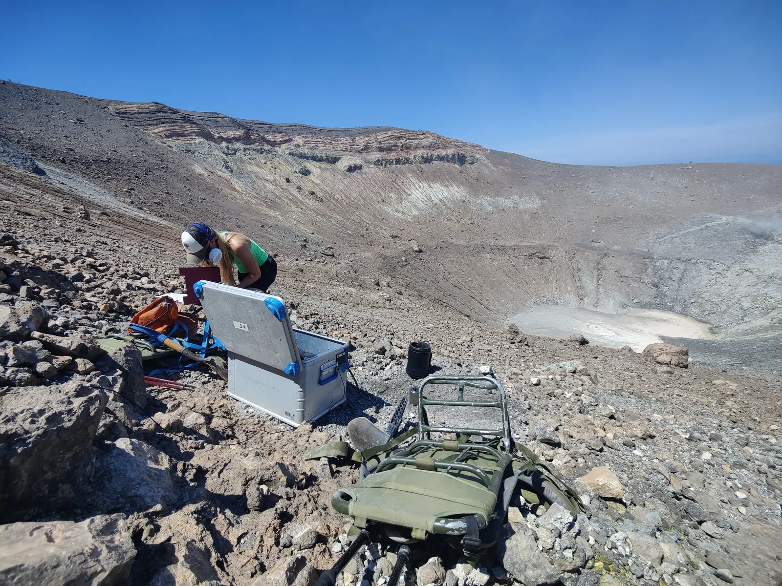 Researchers checking equipment in the crater area.