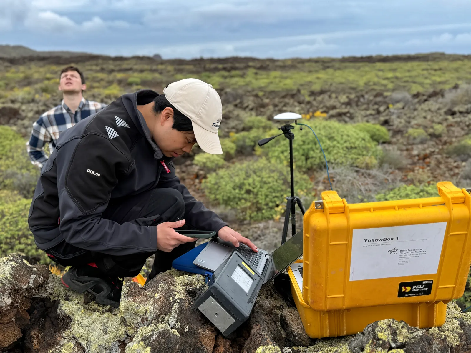 Checking field equipment on Lanzarote’s volcanic terrain.